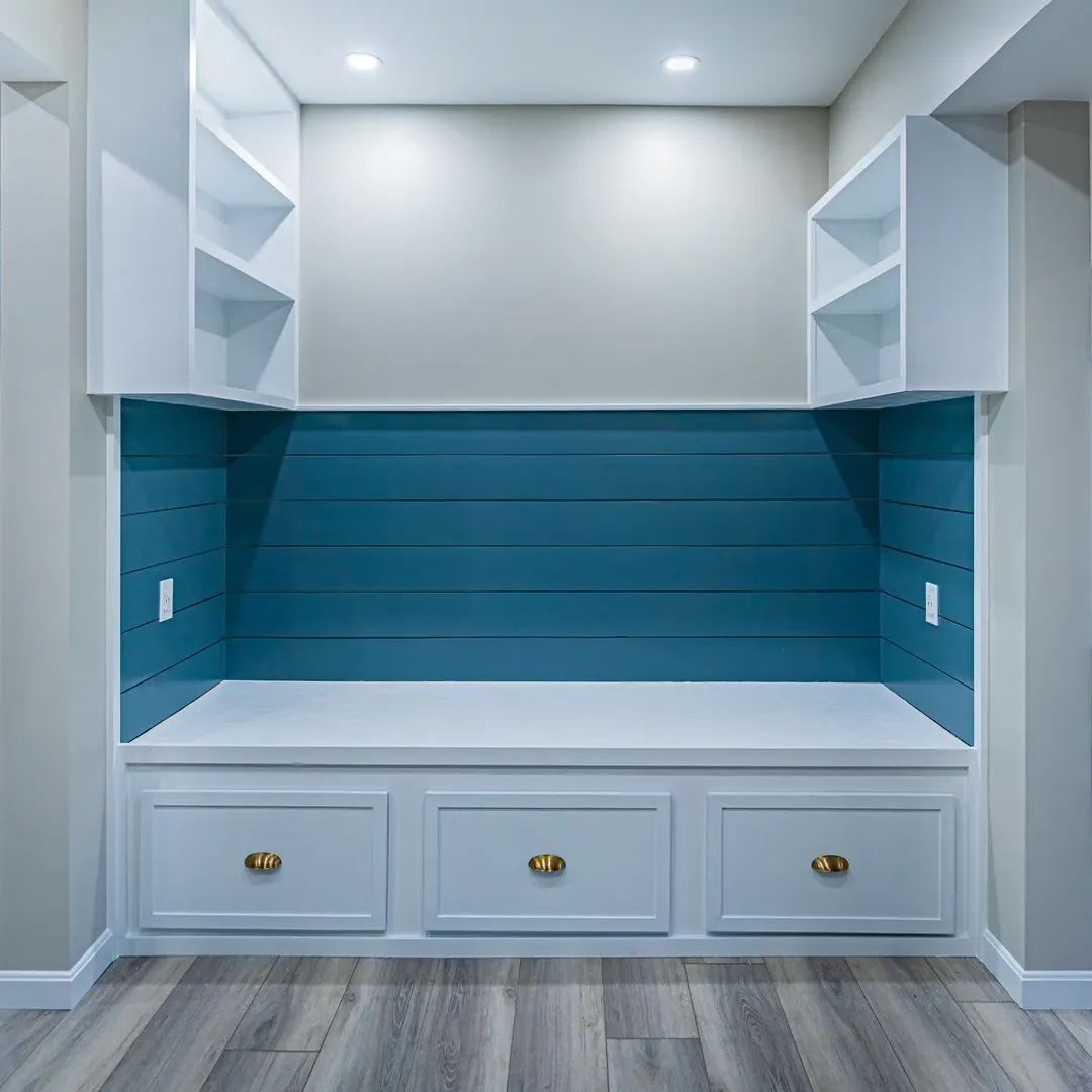 Built-in bench with three storage drawers, shiplap back panel and upper corner shelving